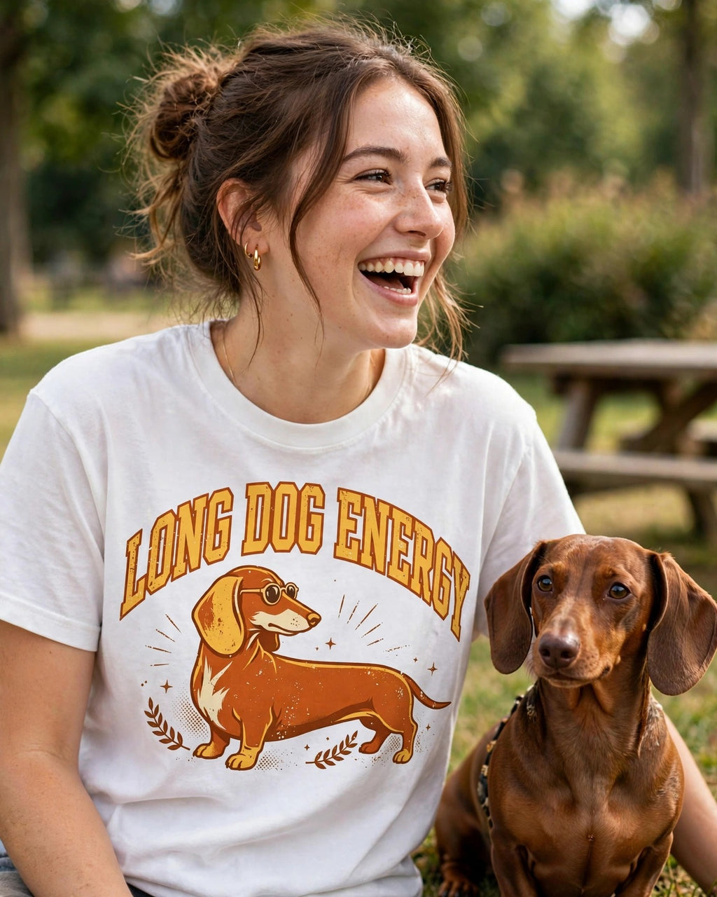Woman wearing the Long Dog Energy dachshund t-shirt outdoors with her dachshund