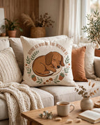 Home Is Where The Wiener Is throw pillow styled on a cozy couch